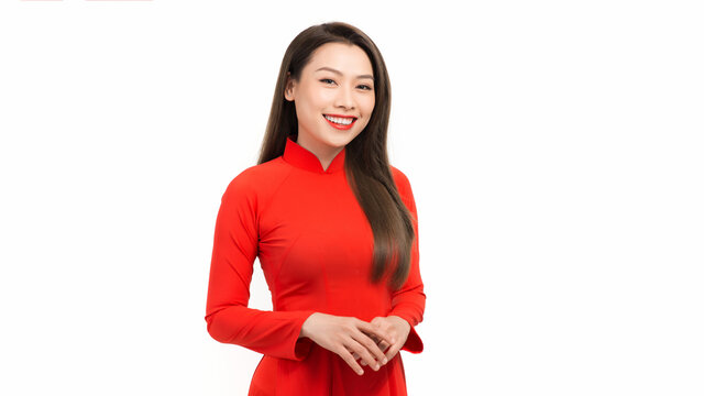 Vietnamese girl wear traditional long dress Ao Dai isolated on white background