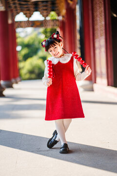 A Chinese girl happily celebrates Chinese festivals, Chinese New Year