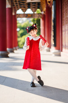 A Chinese girl happily celebrates Chinese festivals, Chinese New Year