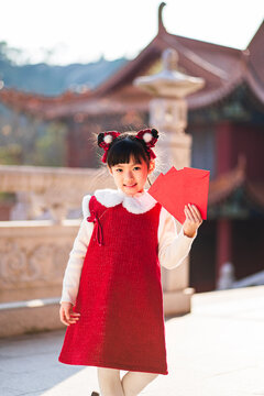 A Chinese girl happily celebrates Chinese festivals, Chinese New Year