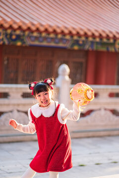A Chinese girl happily celebrates Chinese festivals, Chinese New Year
