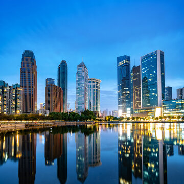 Skyscrapers by the lake, night view of Wuhan, China.