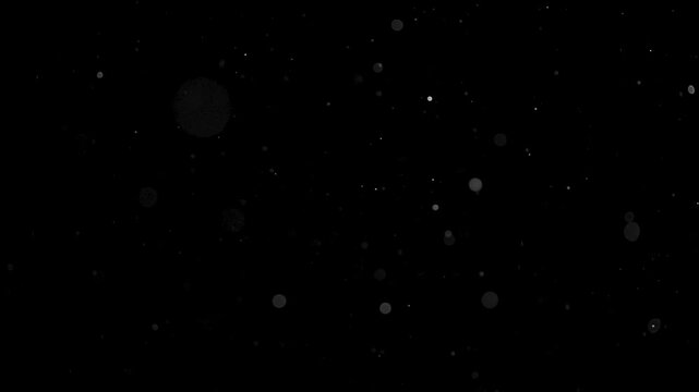 Dust particles swirling in air, backlit shot. High quality 4k footage