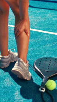 Woman, athlete and tennis injury with leg pain for match accident, muscle massage or workout mistake. Padel sport, person and inflammation on court for fitness training, cardio tension or strain