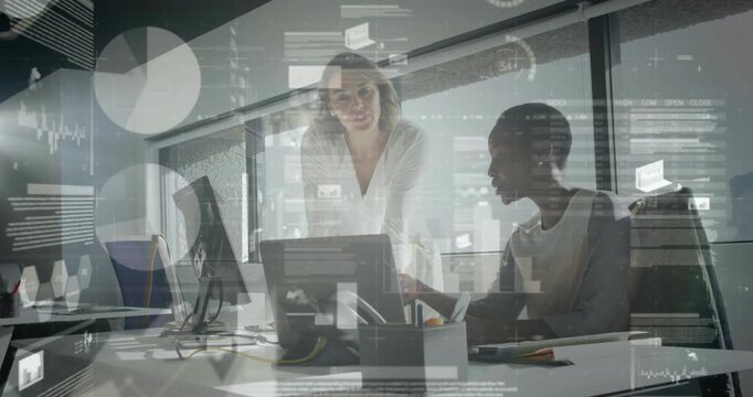 站立的领导身体前倾，手指屏幕，为坐着的同事提供指导，同时平视显示器上的图表在商务场景中浮动